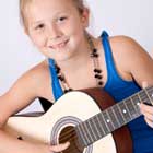child enjoying guitar lesson